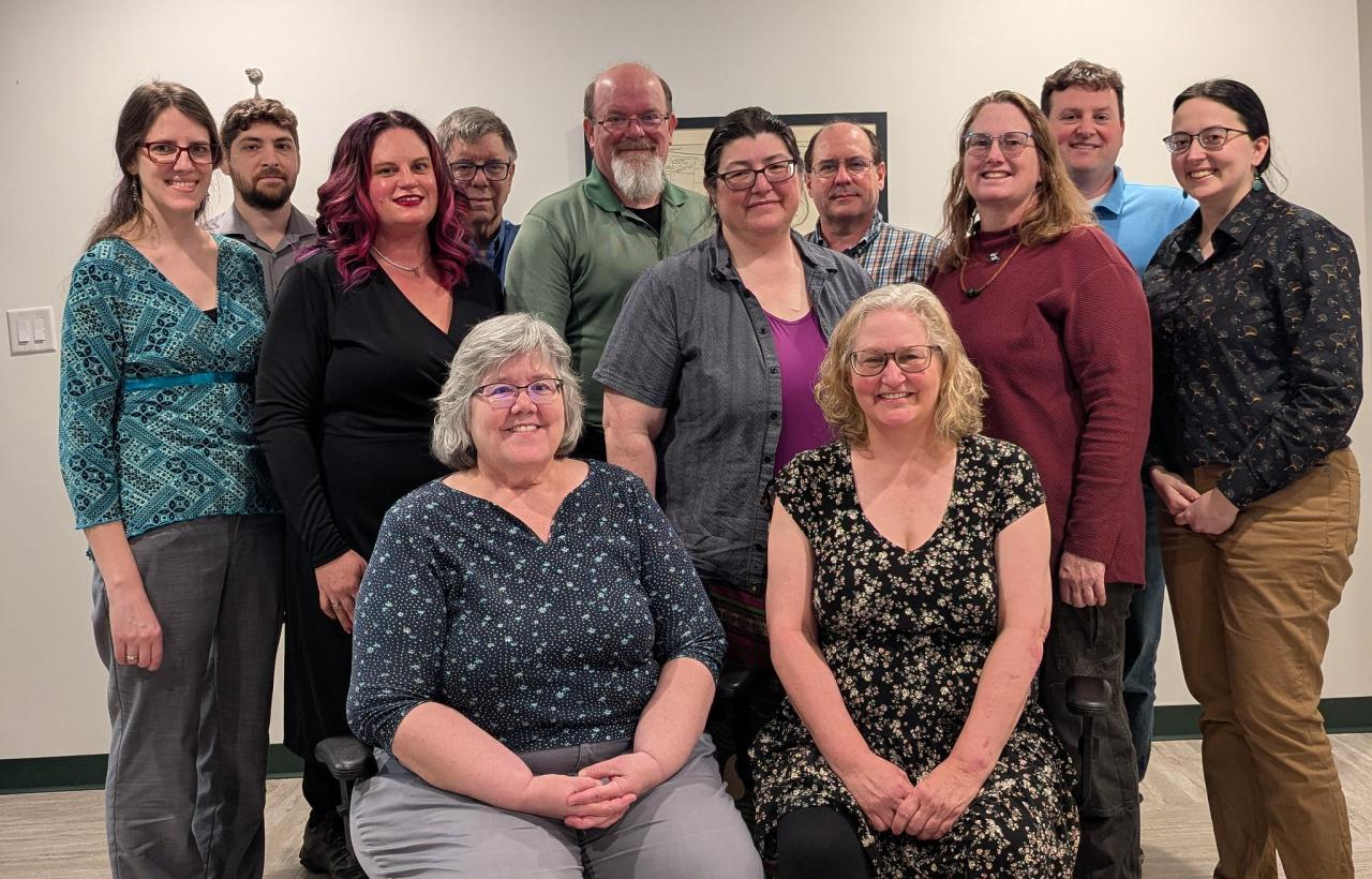 March 2005 photo of Keystone System's Staff. Seated in the first row left to right are Nancy and Tracey. Second row standing left to right are Katharina, Drea, Mitake, Marion, and Katy. Back row left to right are George, Mark, James, Kyle, and John.